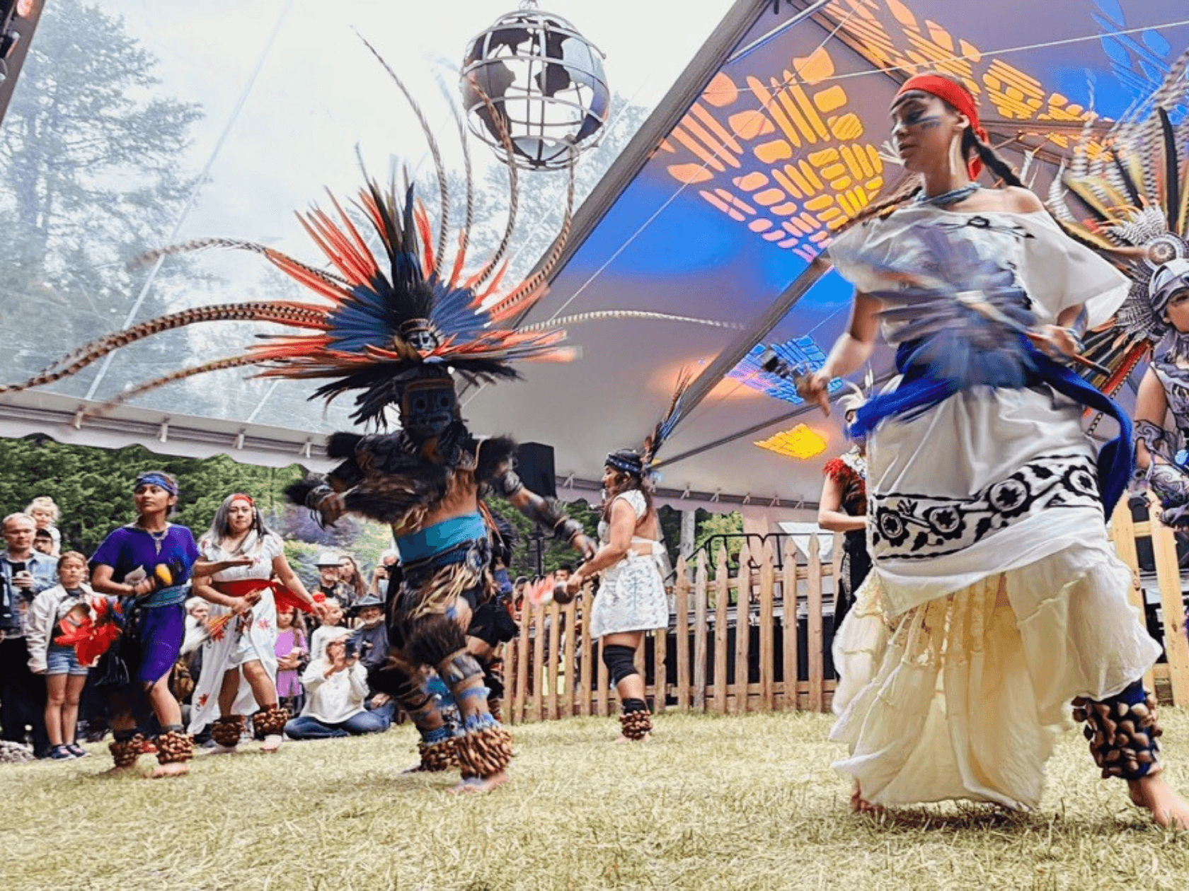 Two Native American Performers showing a crowed a traditional dance